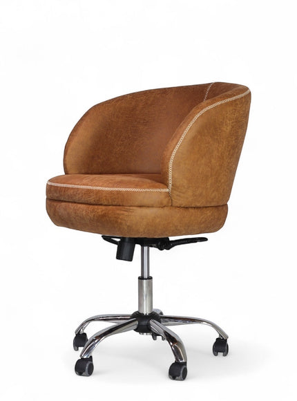 Side angled view of the Vaya Home Hugo swivel office chair with brown faux leather upholstery, rounded backrest, and chrome caster base.