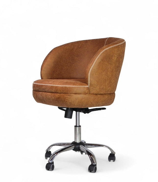 Side angled view of the Vaya Home Hugo swivel office chair with brown faux leather upholstery, rounded backrest, and chrome caster base.
