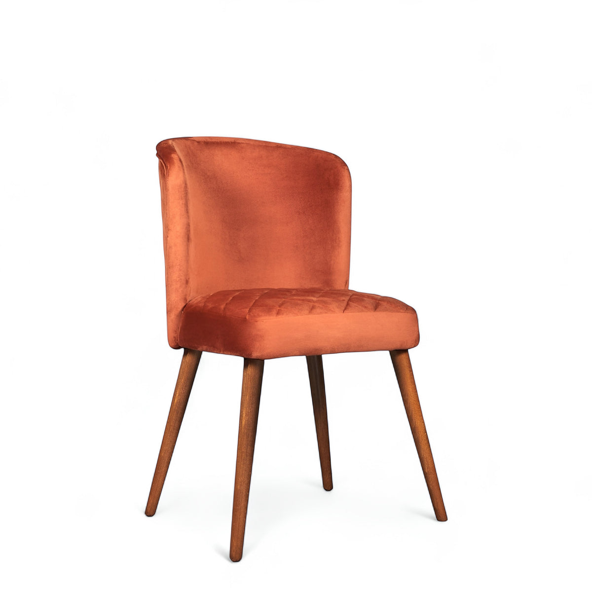 Front angled view of the Vaya Home Inverto dining chair with orange upholstery, curved backrest, and tapered wood legs with gold caps.