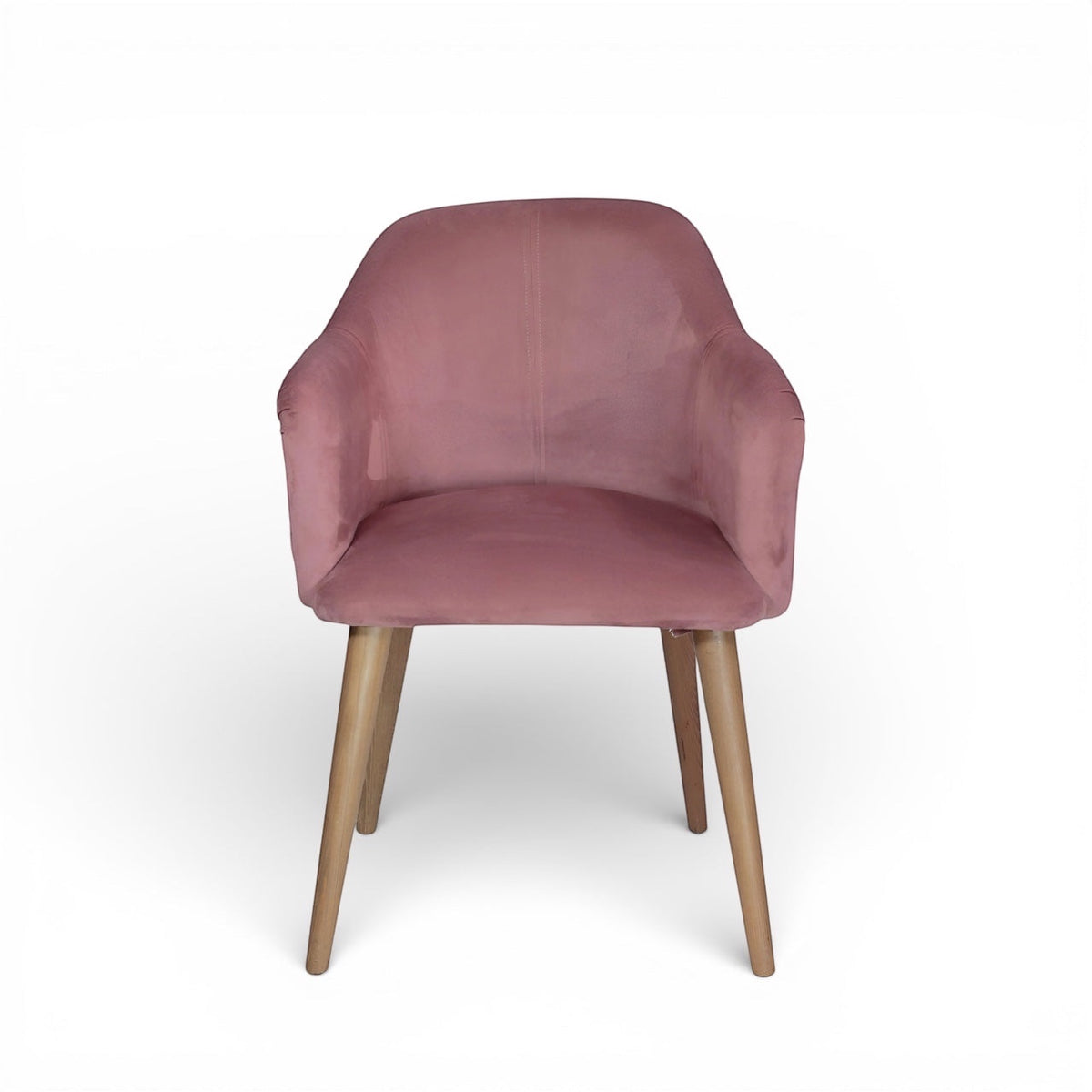 Front angled view of the Vaya Home Lila accent chair with pink velvet upholstery, curved arms, and tapered wood legs.