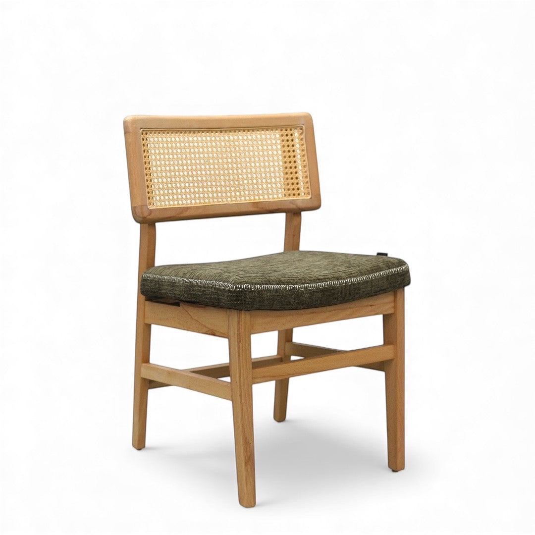 Vaya Home Lino dining chair with a cane backrest, natural wood frame, and upholstered seat cushion.