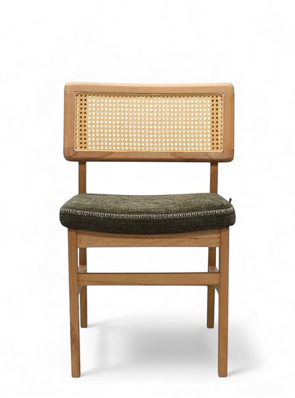 Front view of the Vaya Home Lino dining chair featuring a woven cane back, natural wood frame, and upholstered seat.