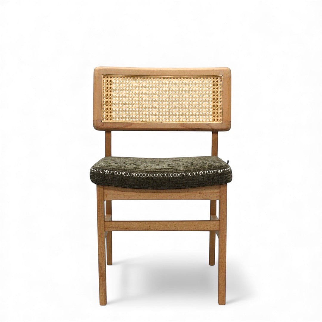 Front view of the Vaya Home Lino dining chair featuring a woven cane back, natural wood frame, and upholstered seat.