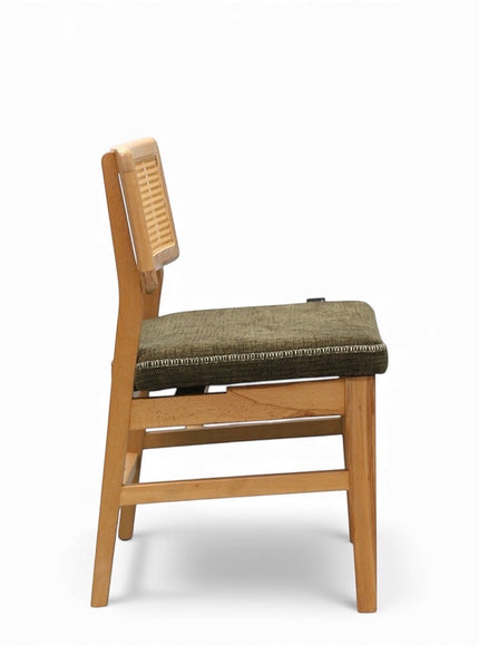 Side view of the Vaya Home Lino dining chair showing the cane backrest, upholstered seat cushion, and wood frame.