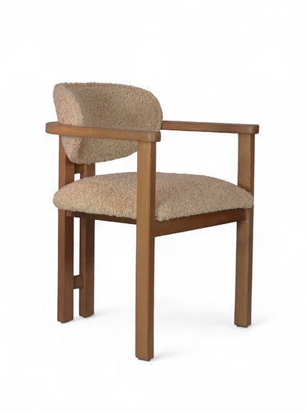Front view of the Vaya Home Loft dining chair with beige boucle upholstery, rounded back cushion, and a warm wood frame.