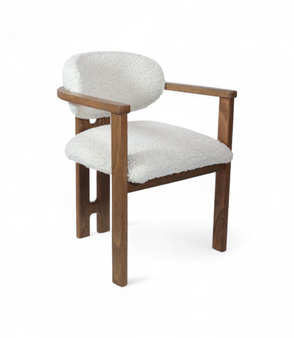 Front view of the Vaya Home Loft dining chair with white boucle upholstery, rounded back cushion, and a warm wood frame.