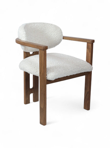 Front view of the Vaya Home Loft dining chair with white boucle upholstery, rounded back cushion, and a warm wood frame.