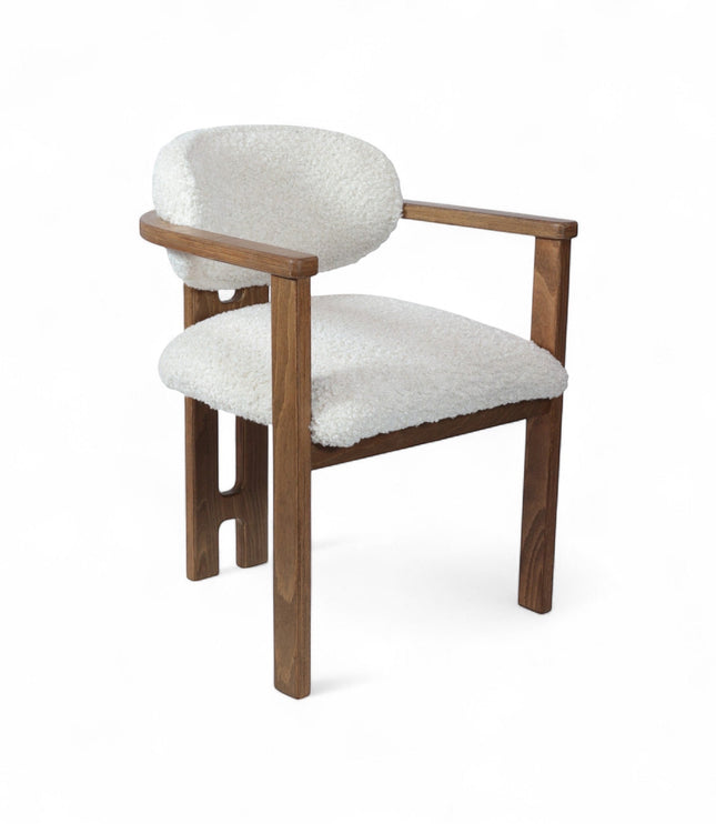 Front view of the Vaya Home Loft dining chair with white boucle upholstery, rounded back cushion, and a warm wood frame.