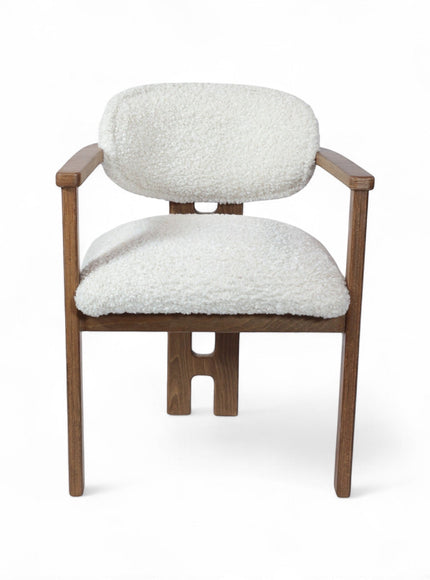 Front view of the Vaya Home Loft dining chair with white boucle upholstery, rounded back cushion, and a warm wood frame.