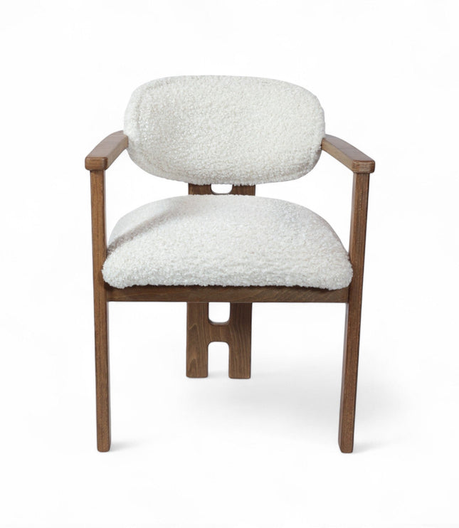 Front view of the Vaya Home Loft dining chair with white boucle upholstery, rounded back cushion, and a warm wood frame.