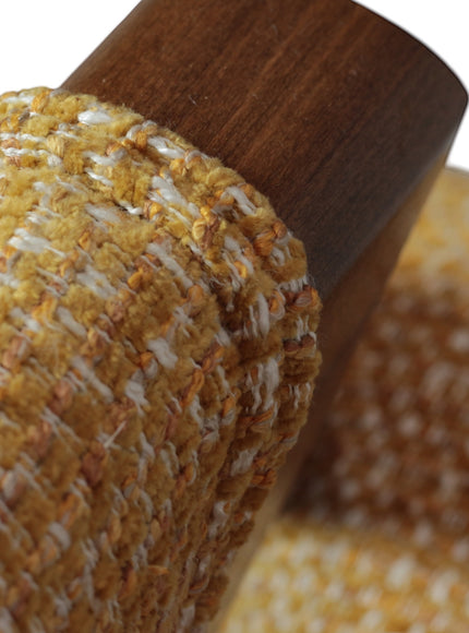 Close-up of the Vaya Home Masiccio dining chair showing yellow woven upholstery and wood frame detail.