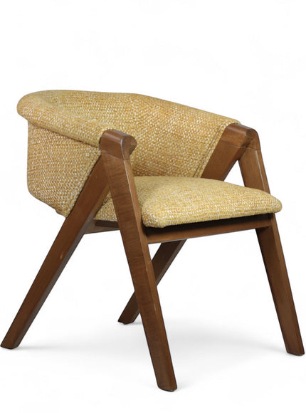 Front angled view of the Vaya Home Masiccio dining chair with yellow woven upholstery, curved back, and wood frame.