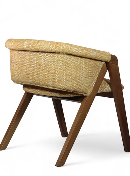 Rear angled view of the Vaya Home Masiccio dining chair with yellow woven upholstery and a warm wood frame.