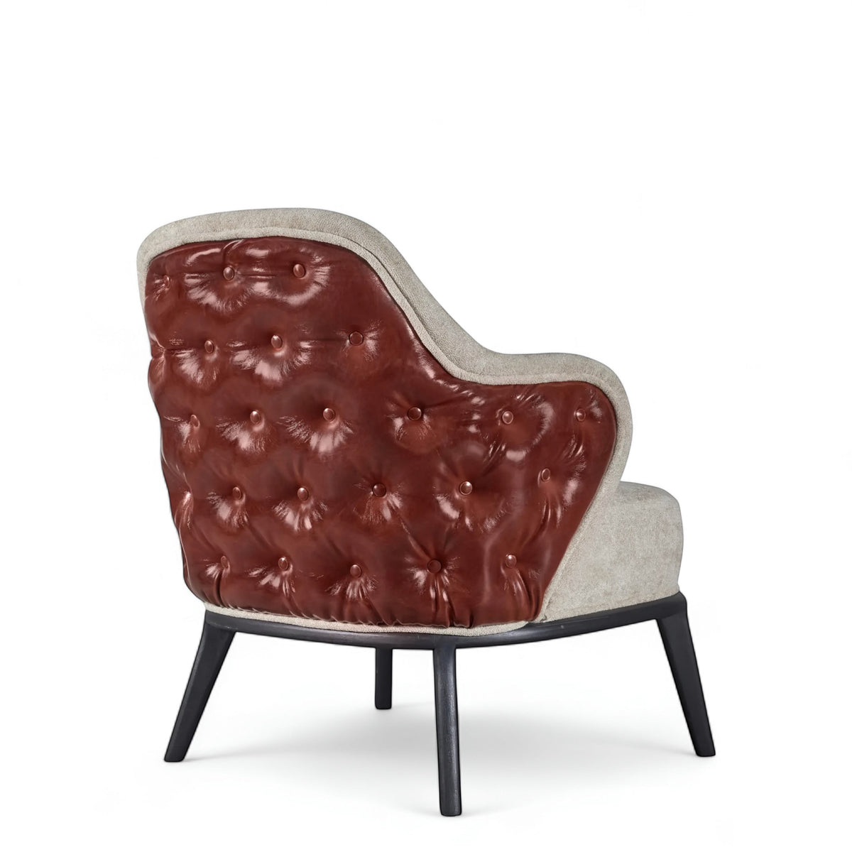 Rear angled view of the Vaya Home Mattonne accent chair with a button-tufted burgundy outer back, beige upholstered seat, and black legs.