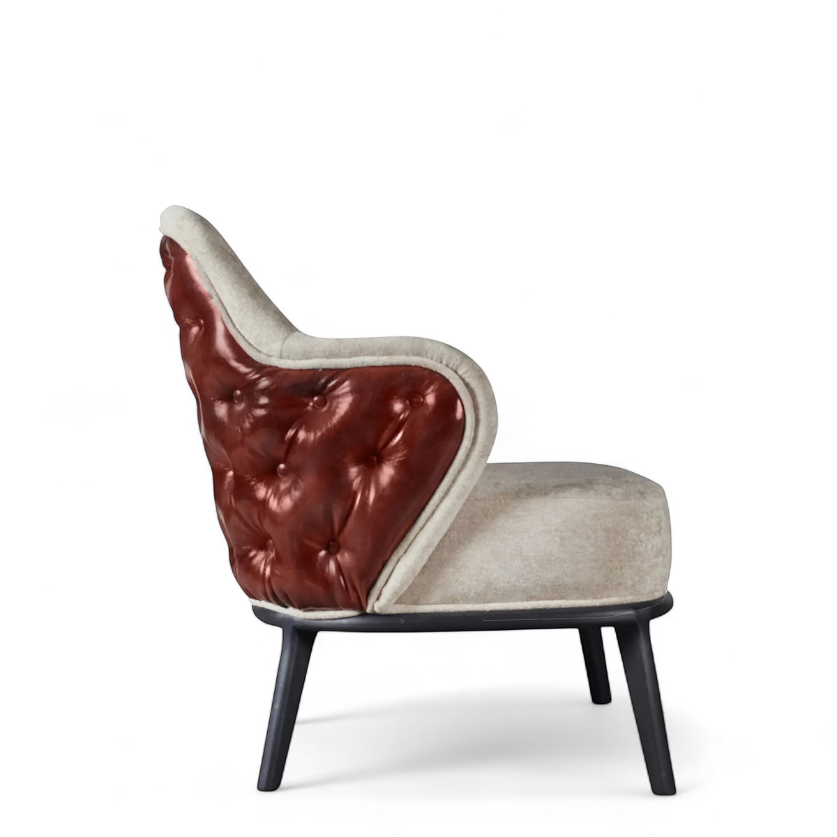 Side view of the Vaya Home Mattonne accent chair featuring beige upholstery, a tufted burgundy outer back, curved arms, and black legs.
