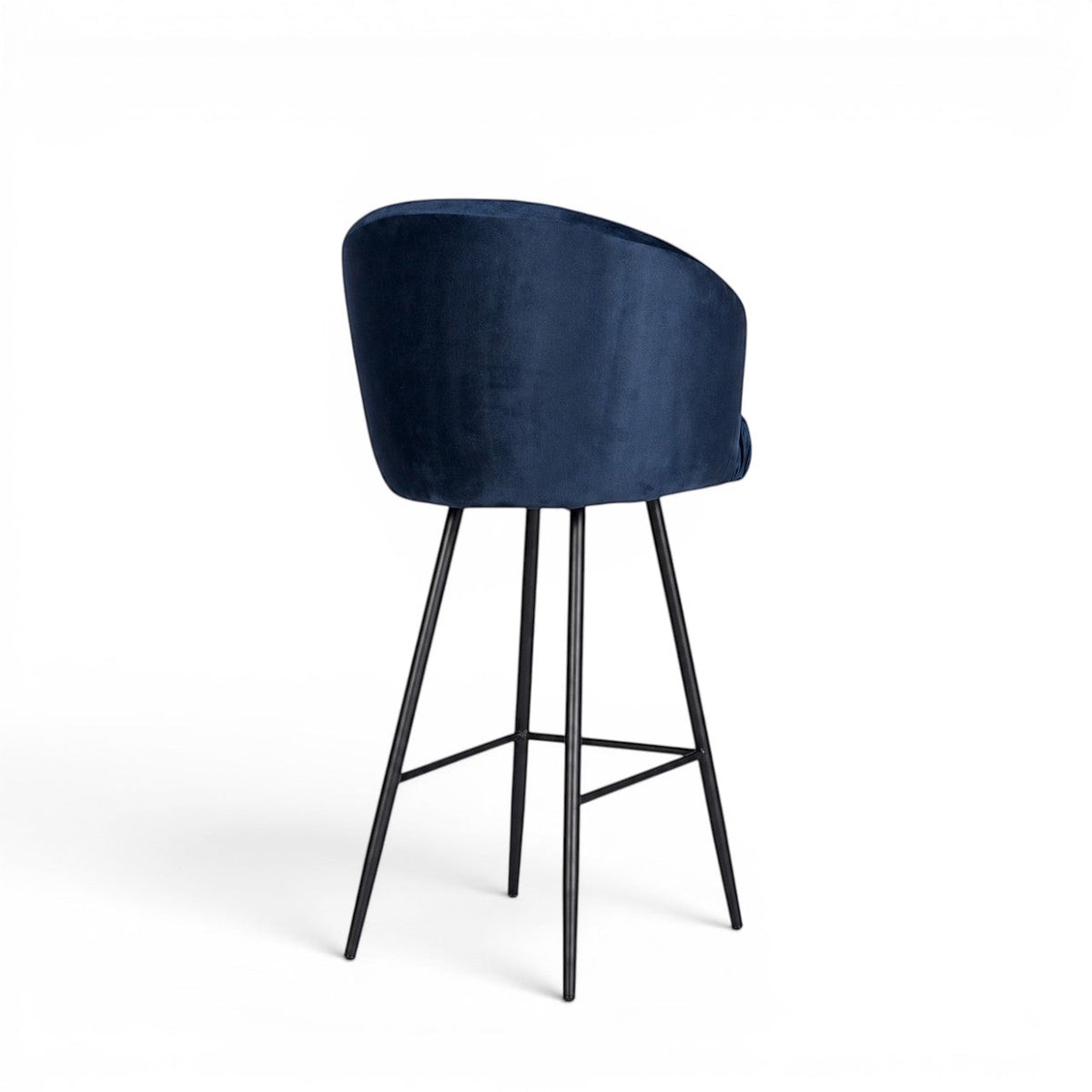 Back view of the Vaya Home Midnight bar stool with dark blue velvet upholstery and a black metal base.