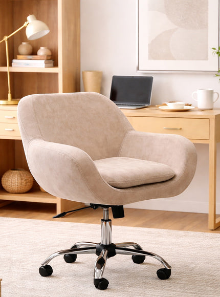 Vaya Home Milan swivel office chair in beige upholstery with a chrome base, styled in a modern home office.