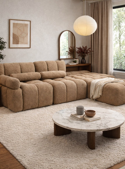 Vaya Home Moducube modular sofa in beige boucle upholstery, styled in a modern living room with ottoman.