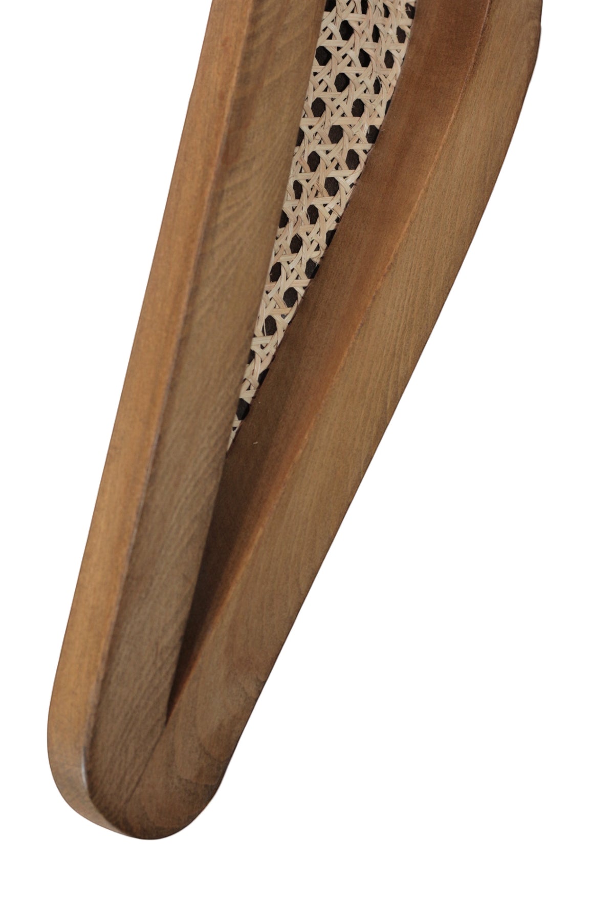 Close-up of the Vaya Home Morbido dining chair showing woven cane and curved wood frame detail.