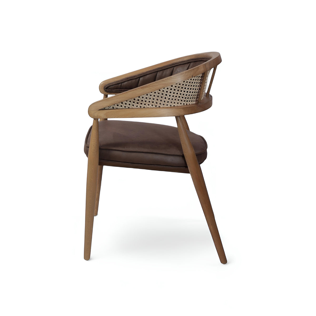 Rear angled view of the Vaya Home Morbido dining chair with a woven cane back, dark brown seat cushion, and curved wood frame.