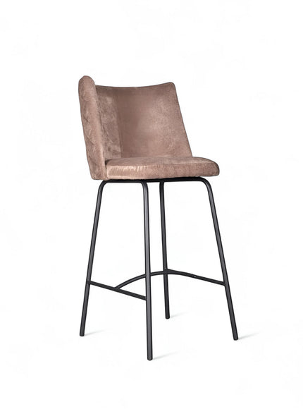 Front angled view of the Vaya Home Morkrod bar stool with beige quilted upholstery and black metal legs.