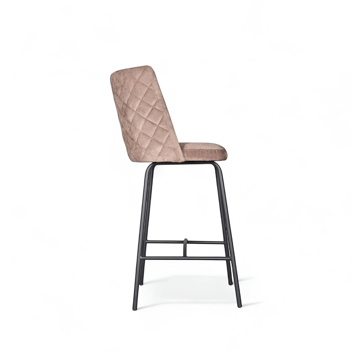 Side view of the Vaya Home Morkrod bar stool featuring beige quilted upholstery and black metal legs.