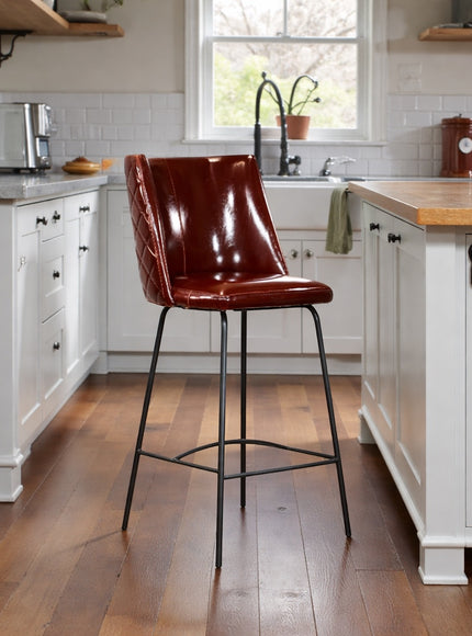 Vaya Home Morkrod bar stool in dark brown quilted upholstery, styled at a modern kitchen island.