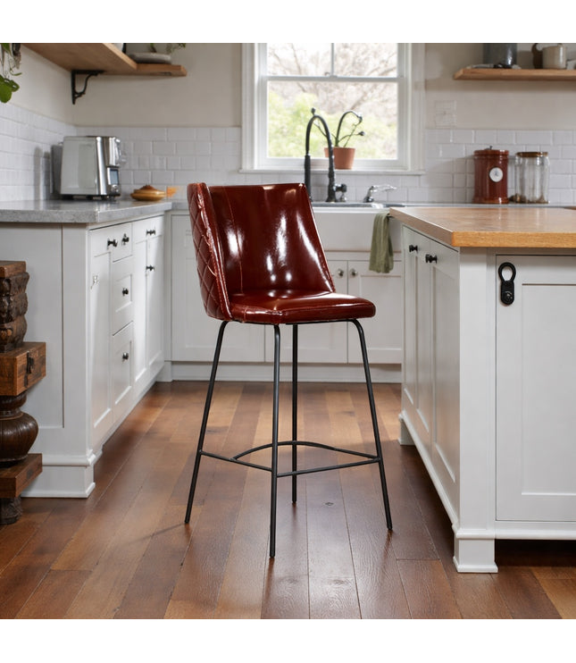 Vaya Home Morkrod bar stool in dark brown quilted upholstery, styled at a modern kitchen island.