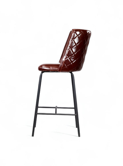 Opposite side view of the Vaya Home Morkrod bar stool featuring dark brown quilted upholstery and black metal legs.