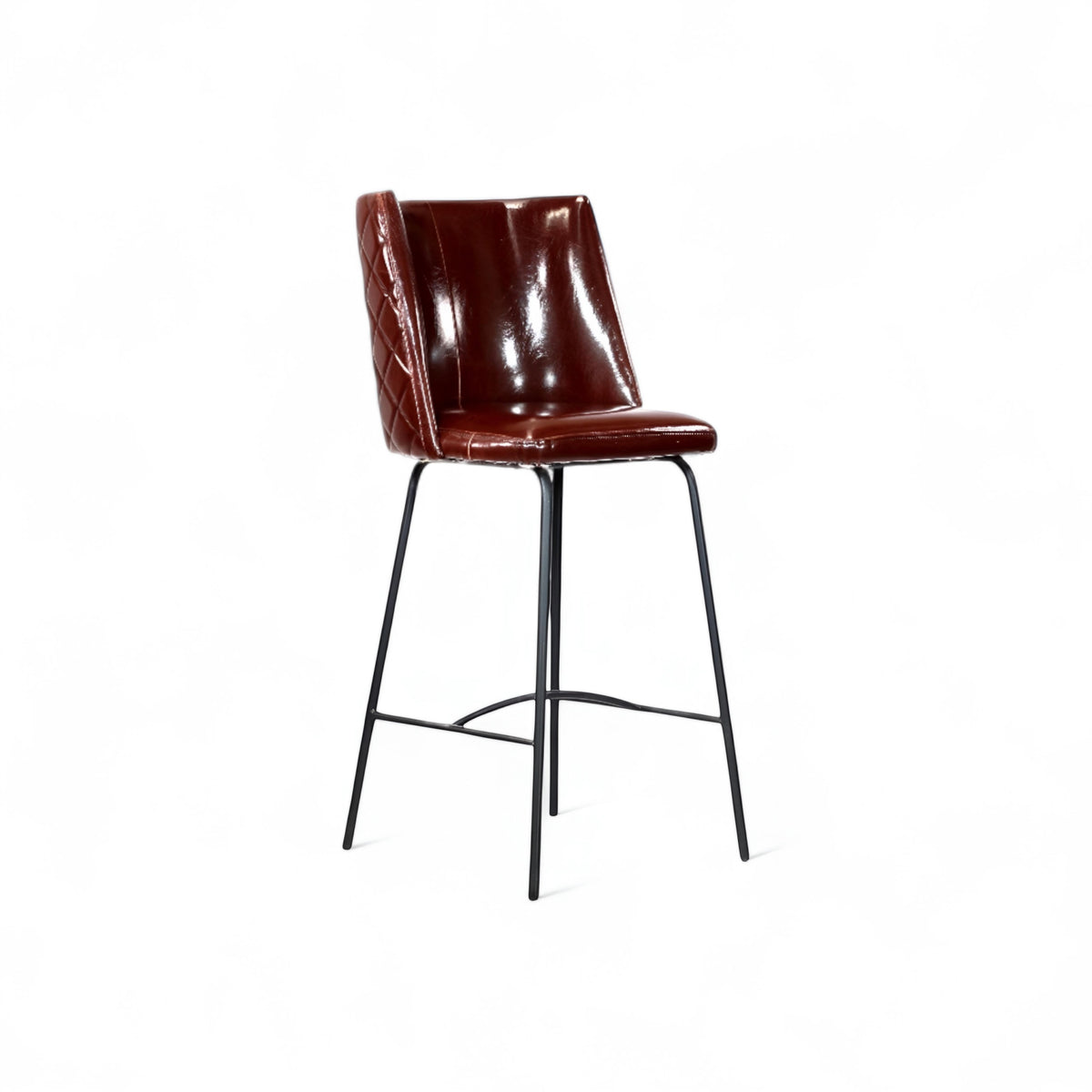 Front angled view of the Vaya Home Morkrod bar stool with rose gold quilted upholstery and black metal legs.