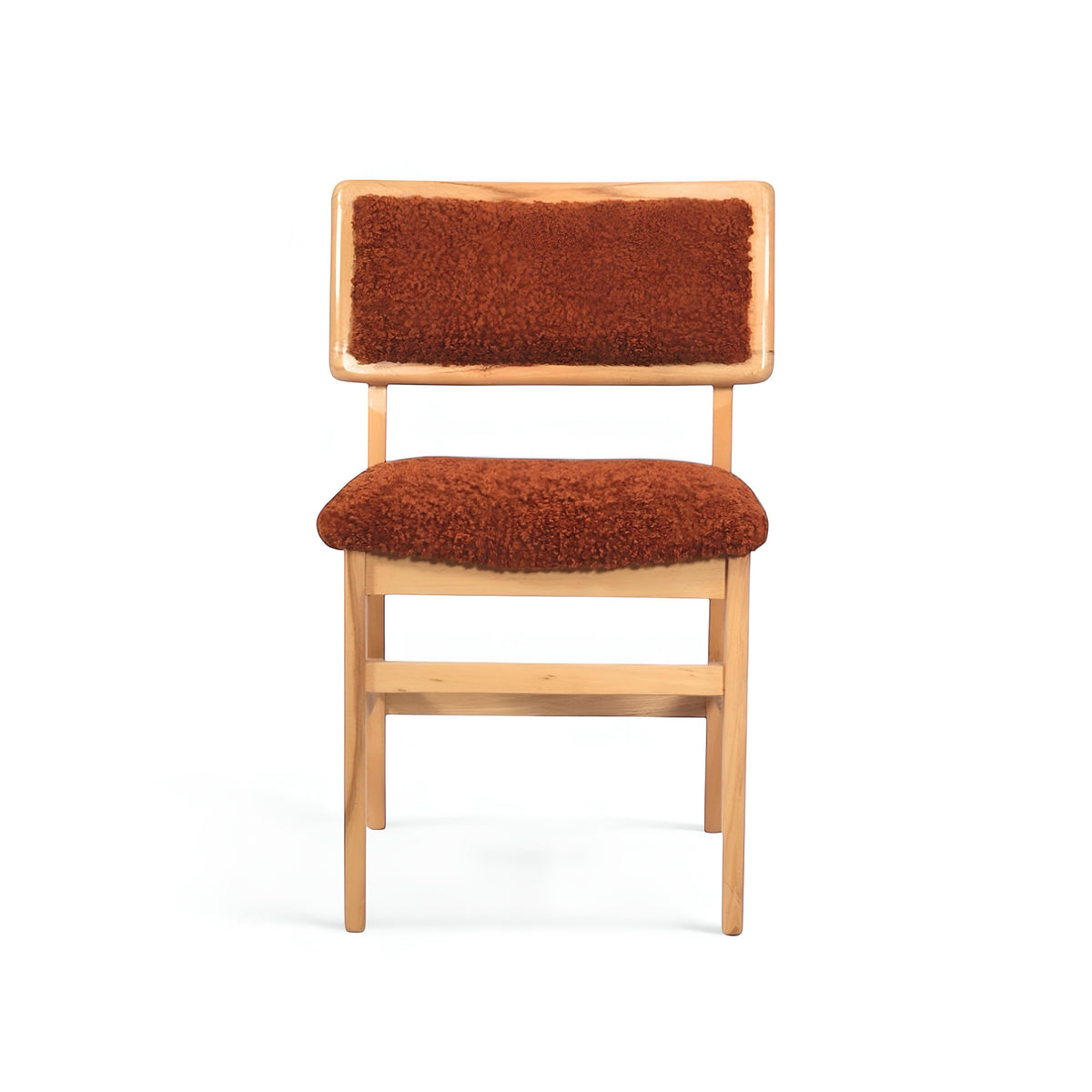 Front view of the Vaya Home Mouton dining chair with orange boucle upholstery and a natural wood frame.
