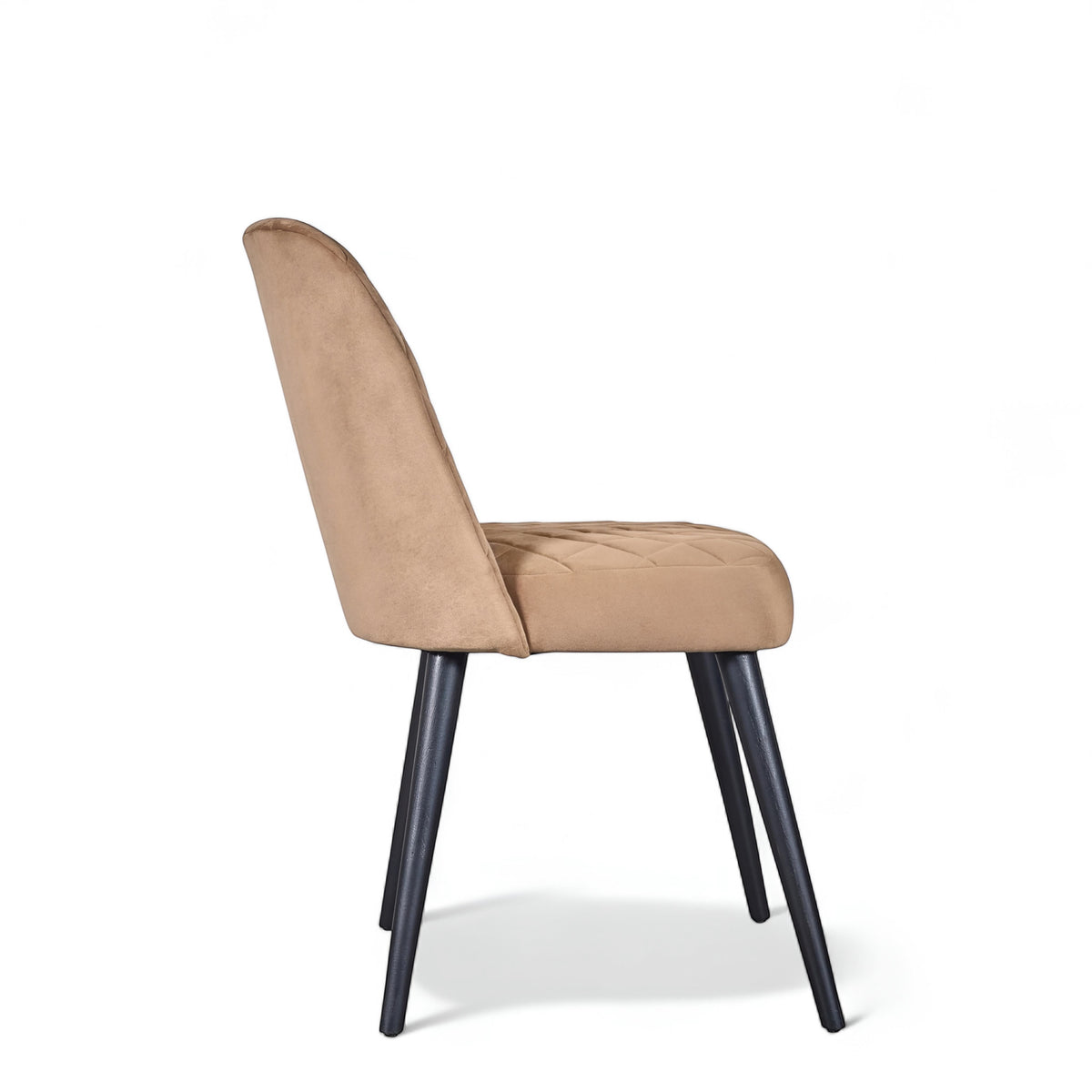 Side view of the Vaya Home Netto dining chair with beige upholstery and black tapered legs.