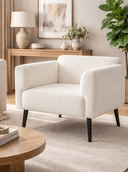 Vaya Home Nexus accent chair in white upholstery, styled in a bright modern living room.