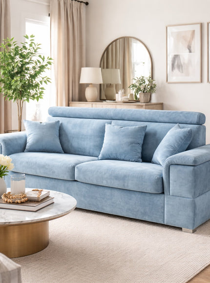 Vaya Home Opulence sofa in blue upholstery, styled in a bright modern living room.