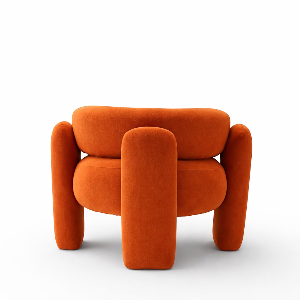 Back view of the Vaya Home Orbit accent chair showing its rounded backrest and sculptural orange upholstered frame.