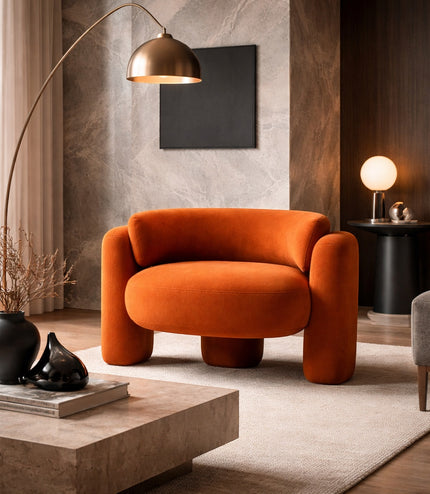 Vaya Home Orbit accent chair in orange upholstery, styled in a modern living room.