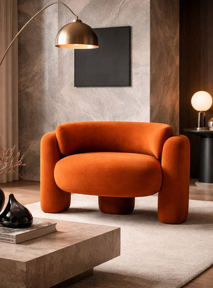 Vaya Home Orbit accent chair in orange upholstery, styled in a modern living room.