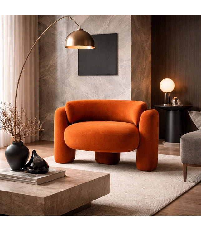 Vaya Home Orbit accent chair in orange upholstery, styled in a modern living room.
