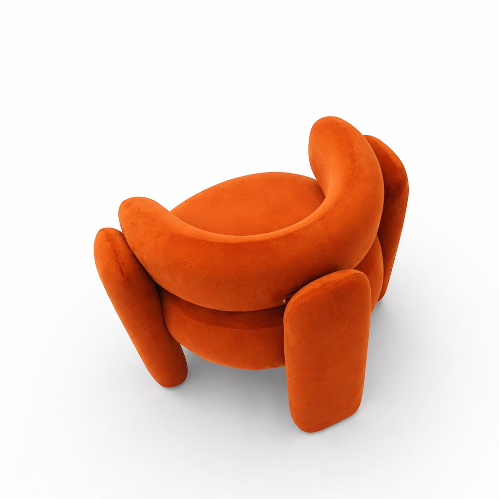 Top angled view of the Vaya Home Orbit accent chair showing its rounded seat, wraparound backrest, and sculptural orange upholstered legs.