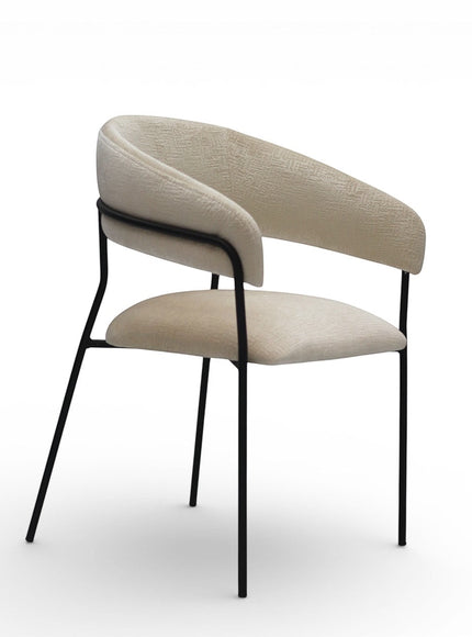 Vaya Home Osso dining chair with cream upholstery, curved wraparound backrest, and black metal frame.
