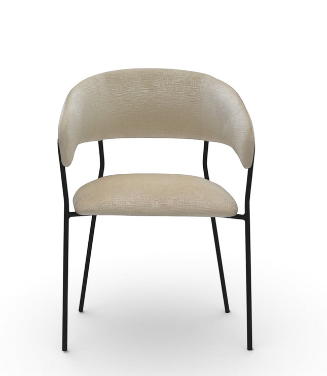 Front view of the Vaya Home Osso dining chair featuring cream upholstery, rounded backrest, and black metal legs.