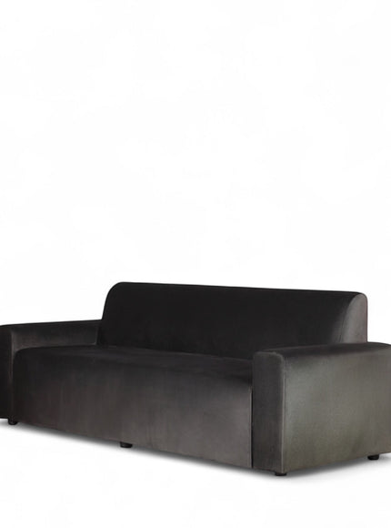 Angled view of the Vaya Home Pacco one-piece sofa with grey upholstery and a low-profile modern silhouette.