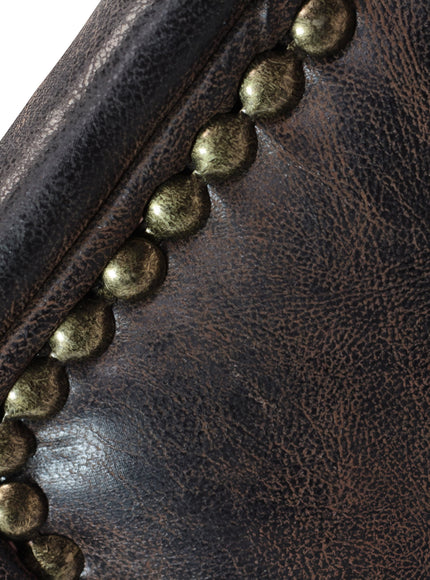 Close-up of the Vaya Home Pelle accent chair showing dark brown leather-look upholstery and nailhead trim detail.