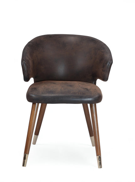 Front view of the Vaya Home Pelle accent chair featuring dark brown leather-look upholstery, a curved backrest, and tapered wood legs with metal caps.