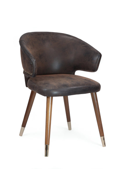 Product view of the Vaya Home Pelle accent chair in dark brown leather-look upholstery with curved back, nailhead trim, and tapered wood legs.
