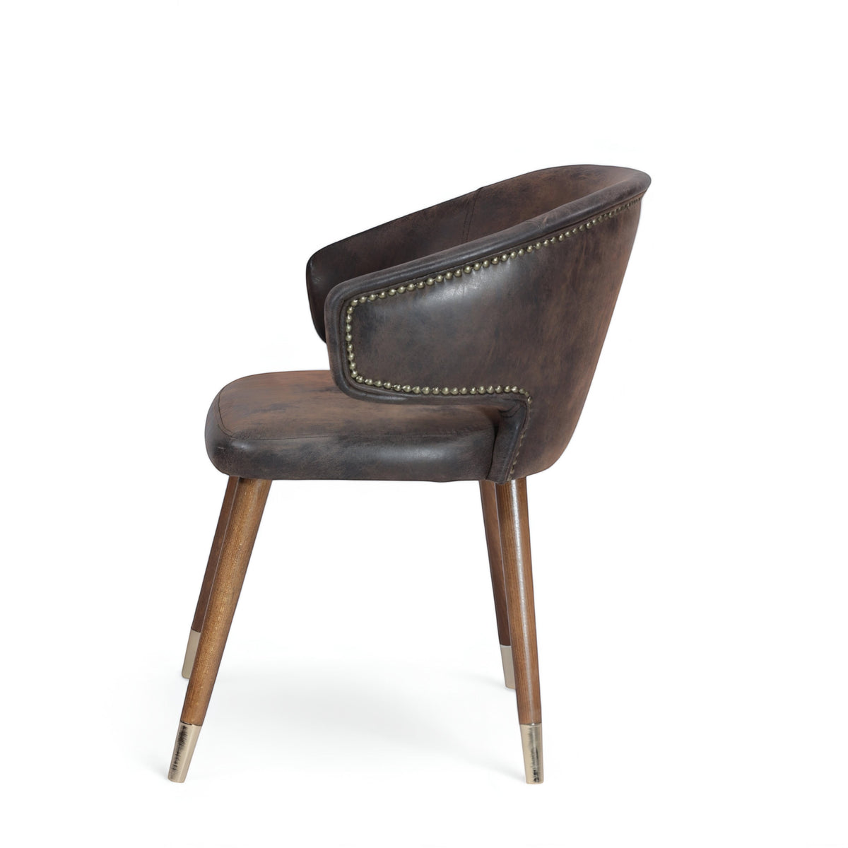 Opposite side view of the Vaya Home Pelle accent chair with dark brown leather-look upholstery, nailhead trim, and tapered wood legs with metal caps.