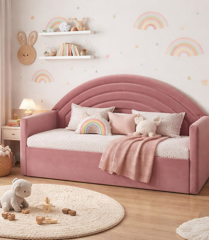 Vaya Home Rainbow kids bed in pink upholstery with an arched rainbow-style headboard, styled in a pastel children's bedroom.