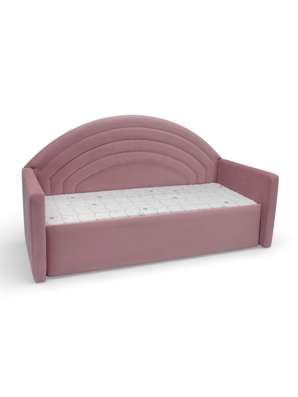 Angled front view of the Vaya Home Rainbow kids bed with pink upholstery, side arms, and an arched rainbow-style headboard.