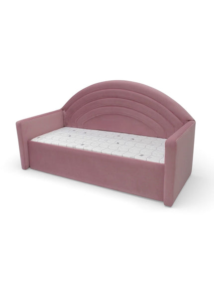 Side angled view of the Vaya Home Rainbow kids bed with pink upholstered frame and rainbow-style arched headboard.