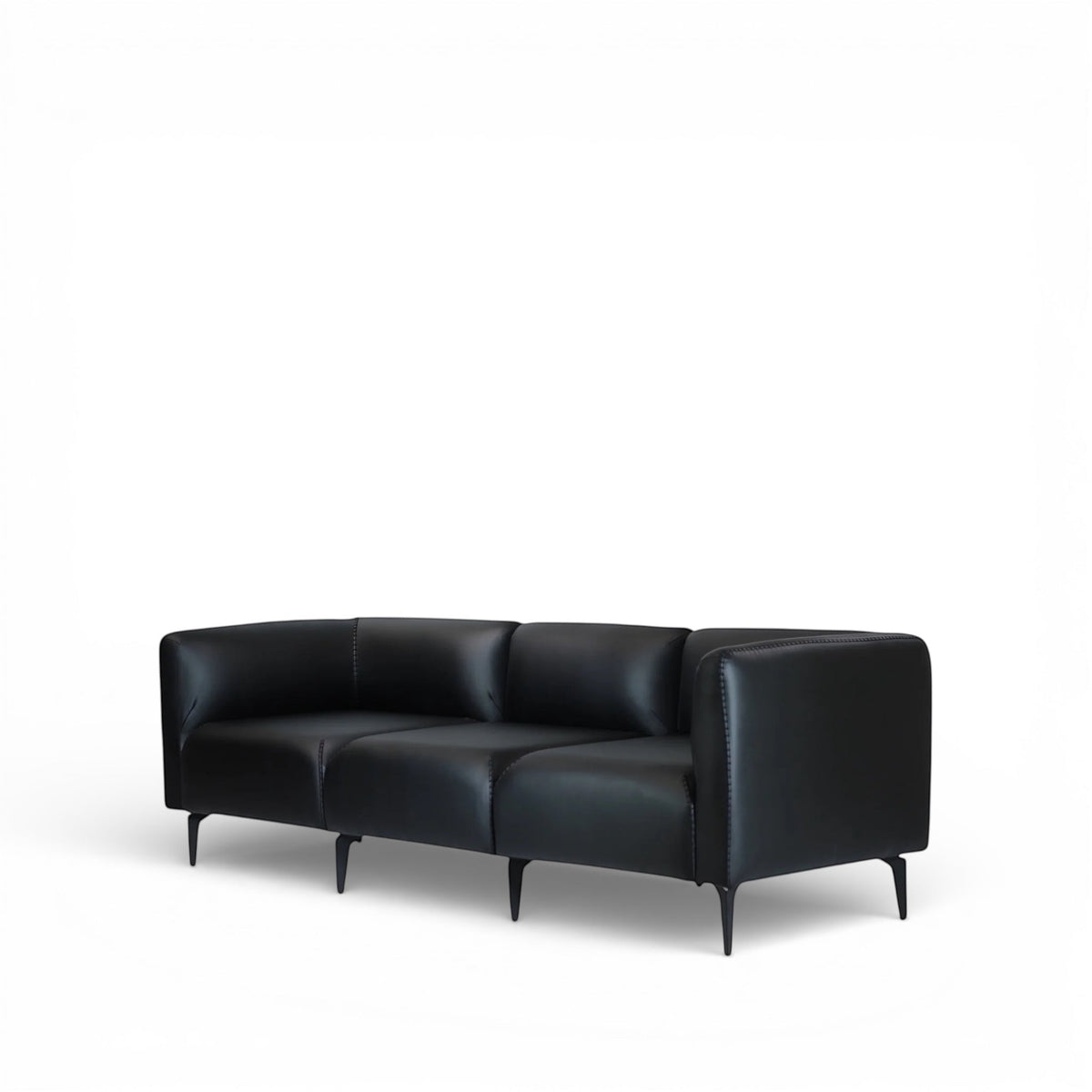 Angled view of the Vaya Home Regalo sofa with black leather upholstery, clean-lined arms, and slim metal legs.